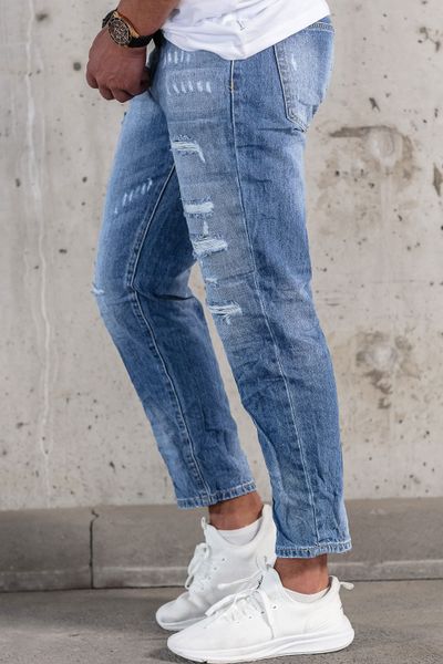 Pantalones vaqueros de hombre azul claro con rotos de tejido lavado a la piedra