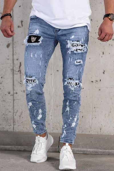vaqueros streetwear azules de hombre con desgaste, lavado a la piedra y broderie decorativo