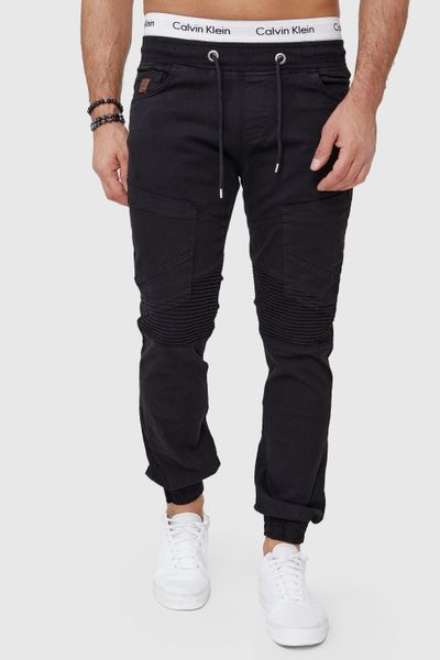 pantalones negros de hombre hasta el muslo con puños de canalé